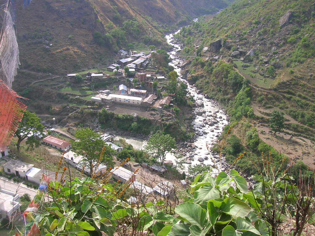 The village of Timure in a steep river valley, photographed before the 2026 flood
